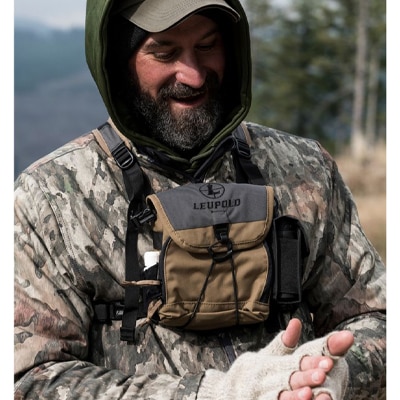 man with a binocular harness