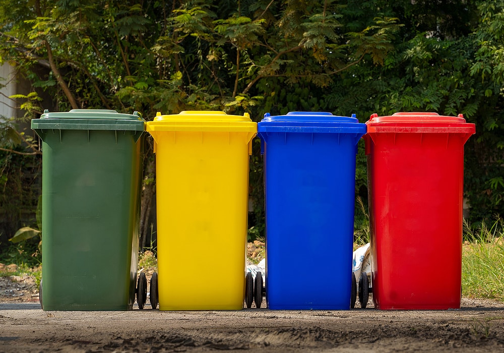 four colorful trashbins