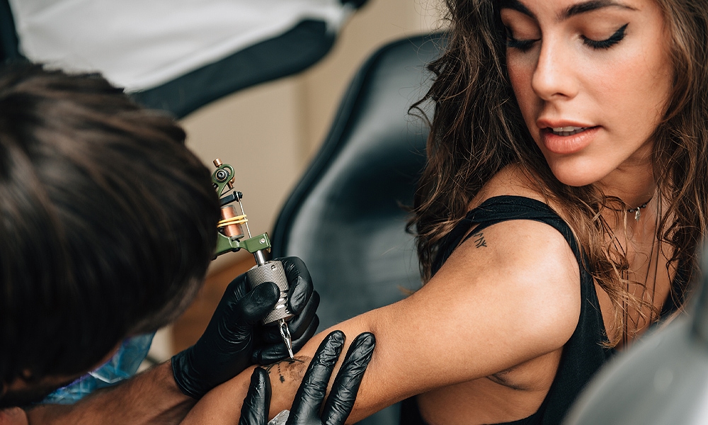 woman getting a tattoo